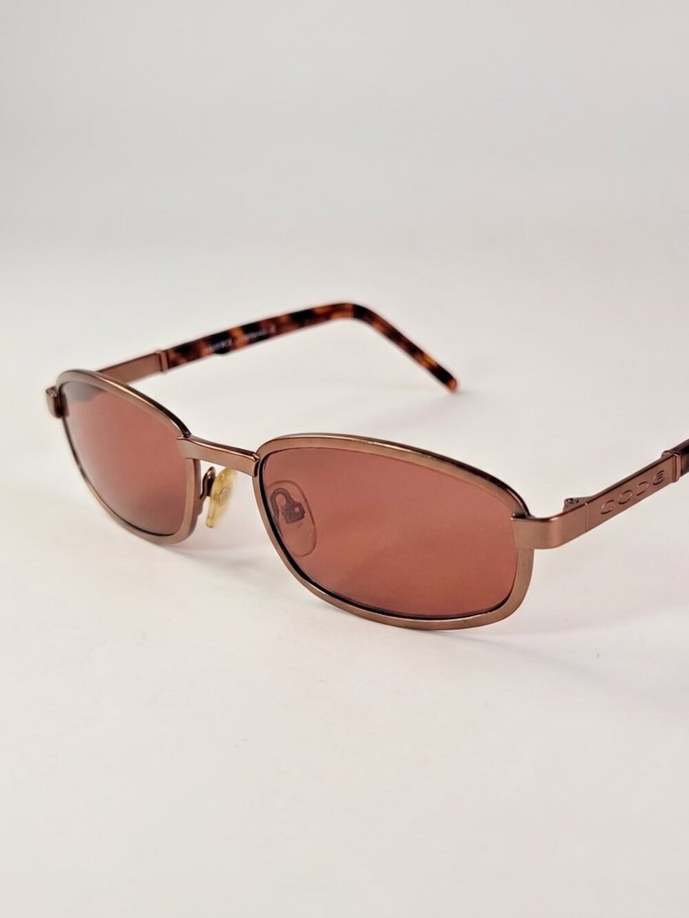 Womans Sunglasses Brand CODEm Copper colored frames and tortoise arms rose lenes